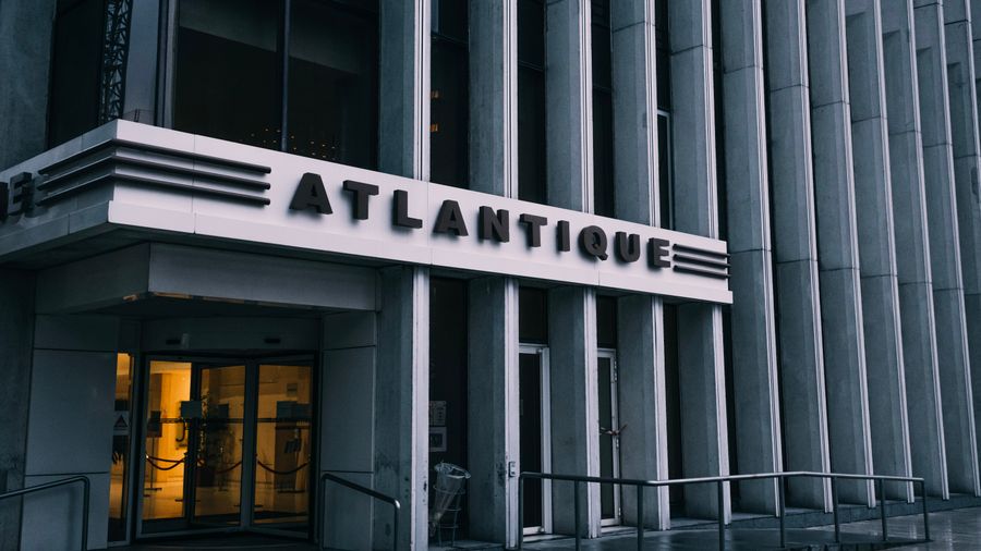 Building identification signage above commercial entrance